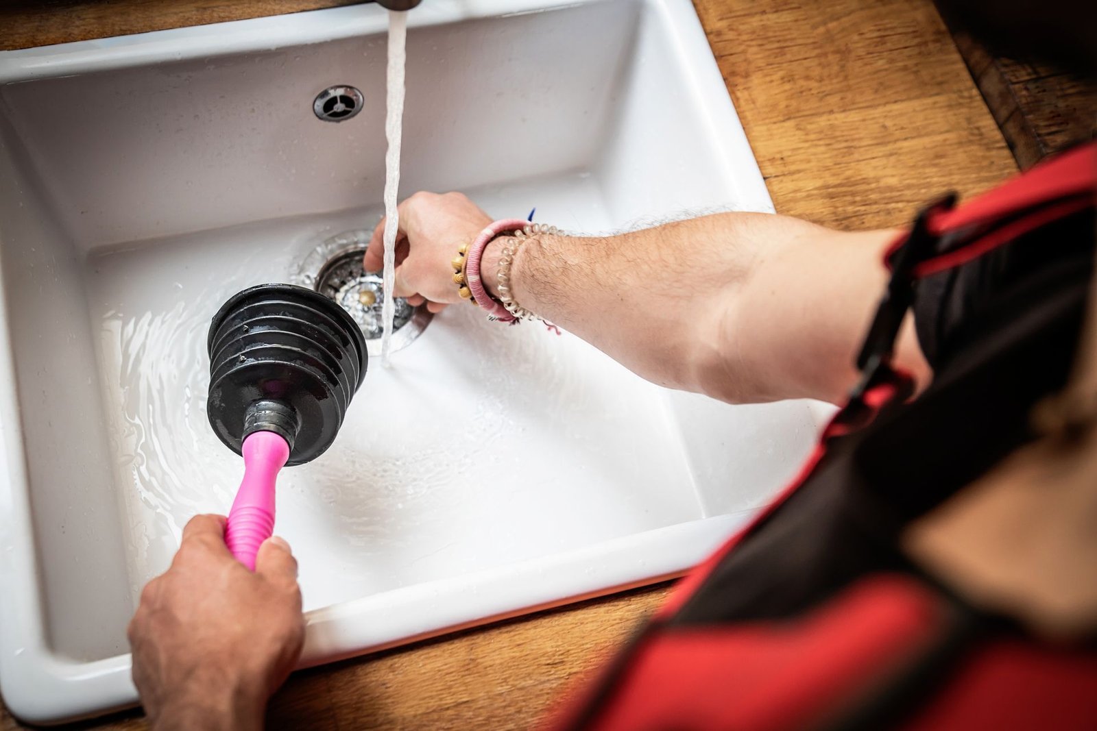 Plumber Using a Pipe Plunger - O’Fallon, MO - O’Fallon Sewer Service Plumber Using a Pipe Plunger - O’Fallon, MO - O’Fallon Sewer Service